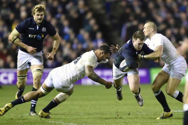 Scotlands Stuart Hogg is on the receiving end as he is tackled by Englands Courtney Lawes and Mike Brown during last seasons Calcutta Cup match at BT Murrayfield. Picture Ian Rutherford