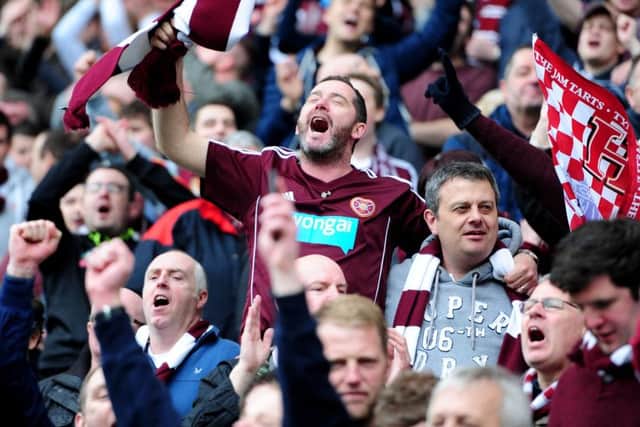 Hearts fans celebrate after the final whistle. Pic Ian Rutherford