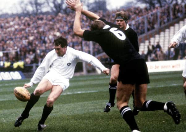 Scotland's Peter Dods clears the ball as Mark Shaw closes in during the 25-25 daw with New Zealand at Murrayfield in 1983. Picture: SNS