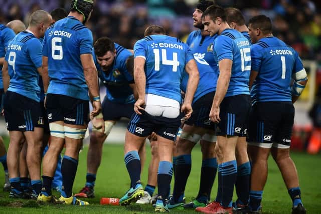 Italy players talk tactics in their famous win over South Africa. Picture: Filippo Monteforte/AFP/Getty