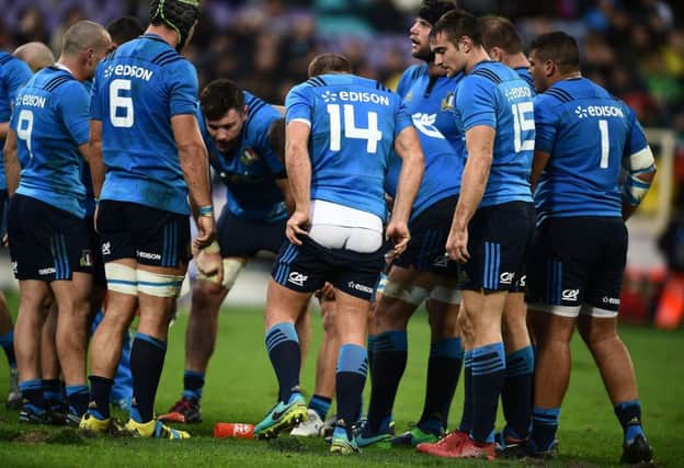 Italy players talk tactics in their famous win over South Africa. Picture: Filippo Monteforte/AFP/Getty