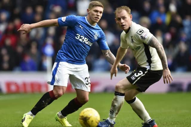 Rangers striker Martyn Waghorn, left, hopes his contribution against Motherwell last week will have earned him a start today. Picture: SNS.