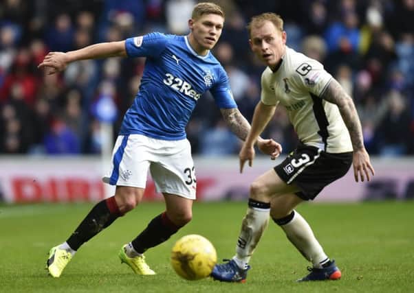 Rangers striker Martyn Waghorn, left, hopes his contribution against Motherwell last week will have earned him a start today. Picture: SNS.