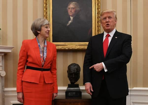 May and Trump before the cameras in the Oval Office. Picture: Stefan Rousseau/PA