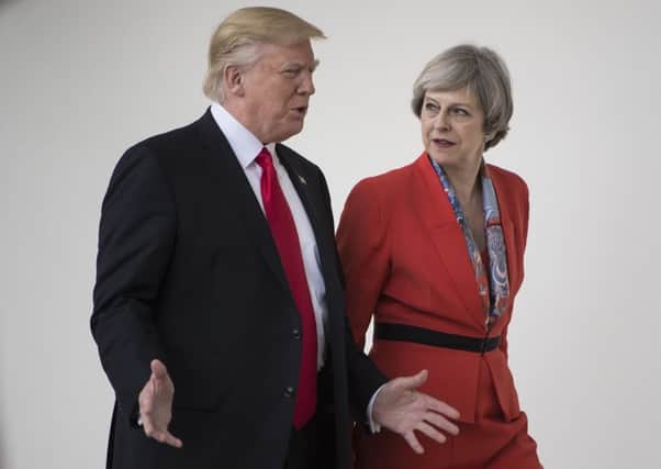 By tying herself to Donald Trump, Theresa May has created a potentially damaging hostage to fortune. Picture: Getty Images