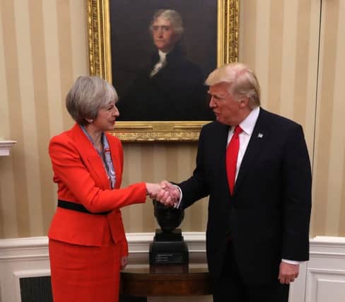 Prime Minister Theresa May shakes hands with U.S. President Donald Trump in The Oval Office at The White House.(Photo by Christopher Furlong/Getty Images)
