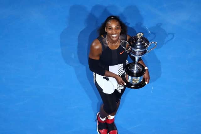 Serena Williams poses with the Daphne Akhurst Trophy after defeating older sister Venus to win the Australian Open. Picture: Cameron Spencer/Getty Images