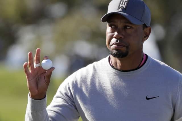 Tiger Woods reacts to the crowd at the 11th hole during the second round of the Farmers Insurance Open. Picture: Gregory Bull/AP