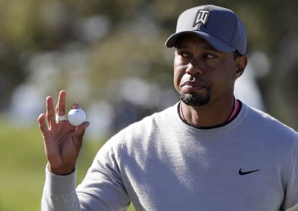 Tiger Woods reacts to the crowd at the 11th hole during the second round of the Farmers Insurance Open. Picture: Gregory Bull/AP
