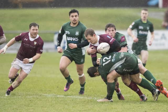 Twos company: Galas Gregor Hunter is sandwiched in a tackle by Hawicks Grant Huggan (12) and Stuart Graham.  Photograph: Gary Hutchison/SNS/SRU