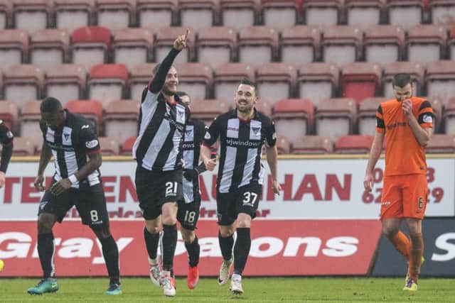 Dunfermlines John Herron (21) , on loan from Blackpool, celebrates his goal with Nicky Clark. Picture: Ross Parker/SNS