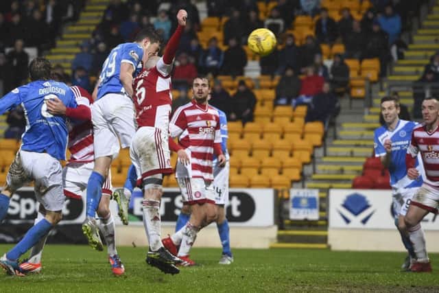 Graham Cummins heads home St Johnstone's opener. Picture: SNS/Bill Murray