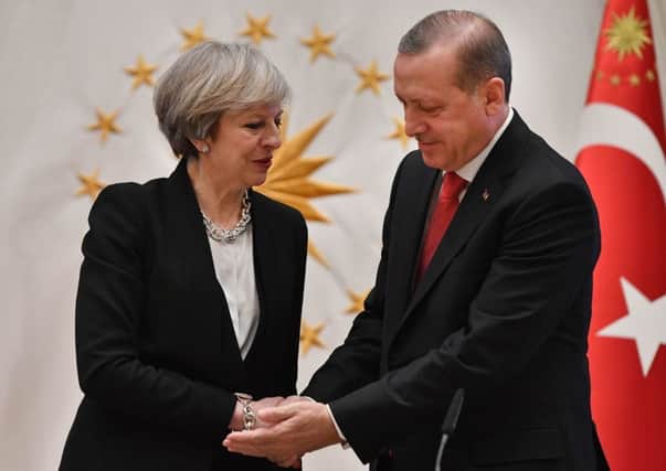 Prime Minister Theresa May shakes hand with the President of Turkey, Recep Tayyip Erdogan, at the Presidential Palace in Ankara. Picture: Andrew Parsons / i-Images/PA Wire
