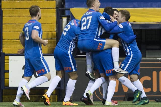 Killie players mob on-loan midfielder Sean Longstaff after his late clincher. Photograph: Alan Harvey/SNS