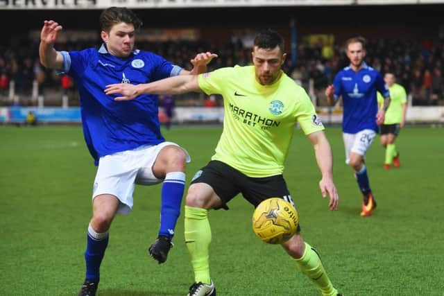 Hibs defender Lewis Stevenson resists the challenge of Queens' Dom Thomas. Picture: SNS.