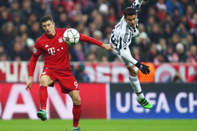 Hernanes, right, tussles with Bayern Munich striker Robert Lewandowski during a Champions League clash in March 2016. Picture: Getty Images