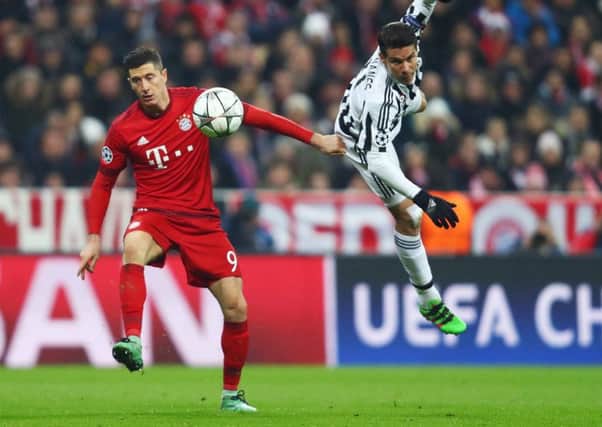 Hernanes, right, tussles with Bayern Munich striker Robert Lewandowski during a Champions League clash in March 2016. Picture: Getty Images