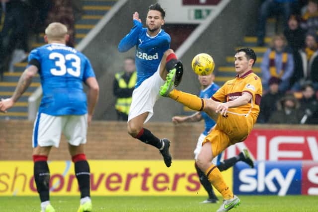Rangers Harry Forrester vies with Carl McHugh of Motherwell for a loose ball. Picture: SNS.