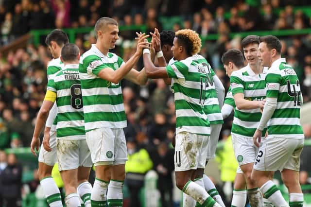 Celtic's Scott Sinclair (right) celebrates with Jozo Simunovic after firing home a penalty to make it 4-0. Picture: SNS