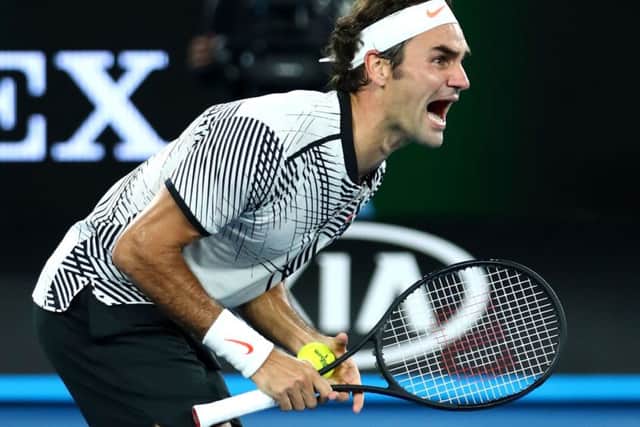 Roger Federer celebrates winning championship point against Rafa Nada, after a titanic struggle over three hours and 38 minutes. It had been a decade since Federer had beaten his greatest rival in the final of a grand slam. Picture: Clive Brunskill/Getty Images