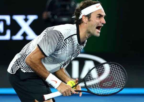 Roger Federer celebrates winning championship point against Rafa Nada, after a titanic struggle over three hours and 38 minutes. It had been a decade since Federer had beaten his greatest rival in the final of a grand slam. Picture: Clive Brunskill/Getty Images