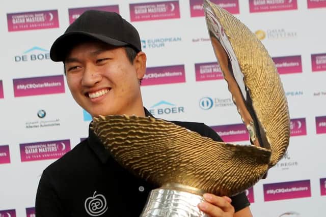 Wang Jeunghun poses with the trophy after winning the Qatar Masters. Picture: Getty.