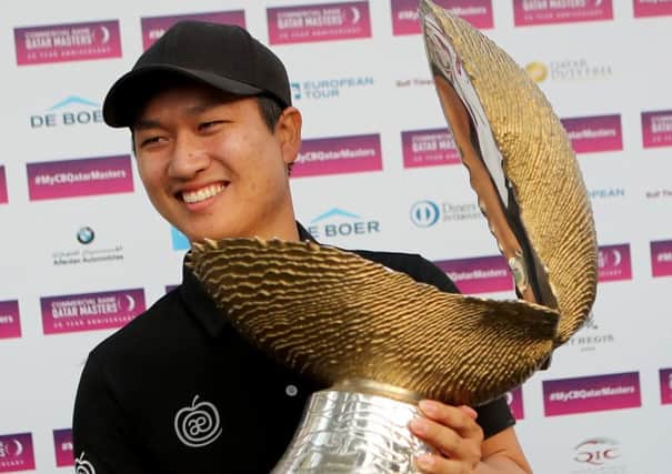 Wang Jeunghun poses with the trophy after winning the Qatar Masters. Picture: Getty.