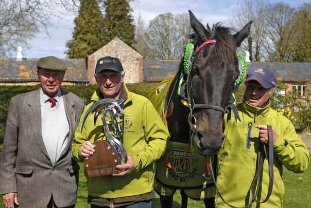 Many Clouds and owner Trevor Hemmings, left, with with trainer Oliver Sherwood and stable lad CJ after the horse won the 2015 Crabbie's Grand National. Picture: Alan Crowhurst/Getty Images