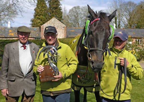 Many Clouds and owner Trevor Hemmings, left, with with trainer Oliver Sherwood and stable lad CJ after the horse  won the 2015 Crabbie's Grand National. Picture: Alan Crowhurst/Getty Images