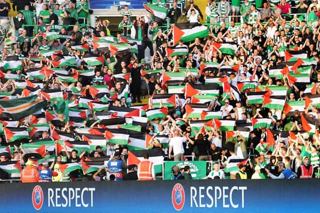Celtic fans protest with Palestinian flags during the win over Hapoel Beer-Sheva last August. Picture: John Devlin