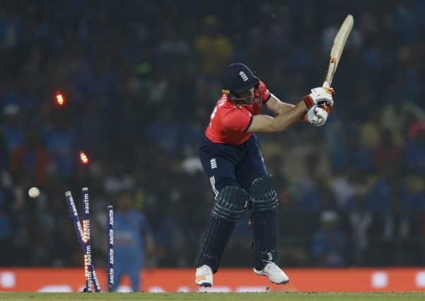England's Jos Buttler is bowled by India's Jasprit Bumrah in the final over of the second Twenty20 international in Nagpur. Picture: AP Photo/Rajanish Kakade
