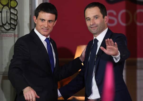 Winner Benoit Hamon, right, with defeated candidate Manuel Valls after the French Socialist Party primary run-off. Picture: AFP/Getty Images