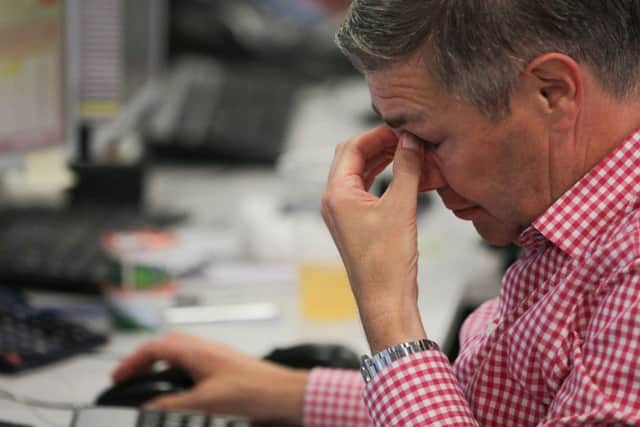 Bill Jamieson asks whether fund managers should cling on in the hope of recovery, or cut their losses. Picture: Daniel Leal-Olivas/AFP/Getty Images