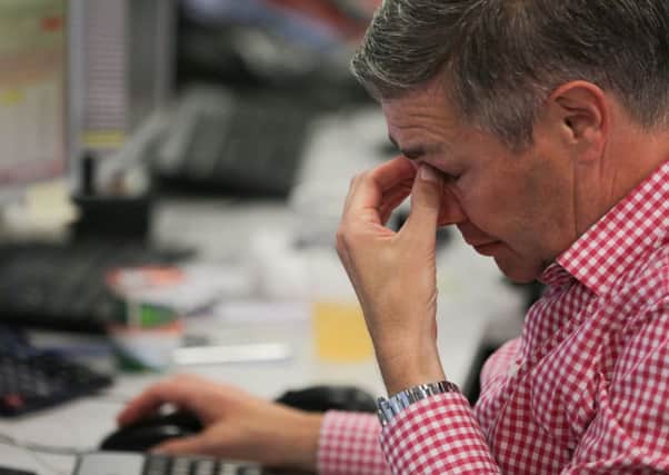 Bill Jamieson asks whether fund managers should cling on in the hope of recovery, or cut their losses. Picture: Daniel Leal-Olivas/AFP/Getty Images