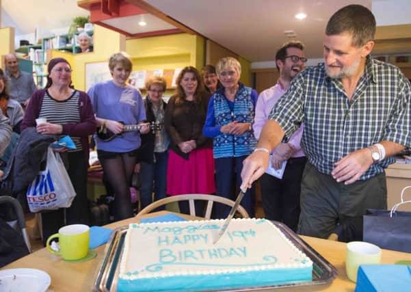 Maggie's Centre in Edinburgh celebrates 19 years with a cake, a song by Emma Milligan and a poem by Angus Ogilvie.
Angus Ogilvie cutting the birthday cake

picture by Alex Hewitt
alex.hewitt@gmail.com
07789 871 540