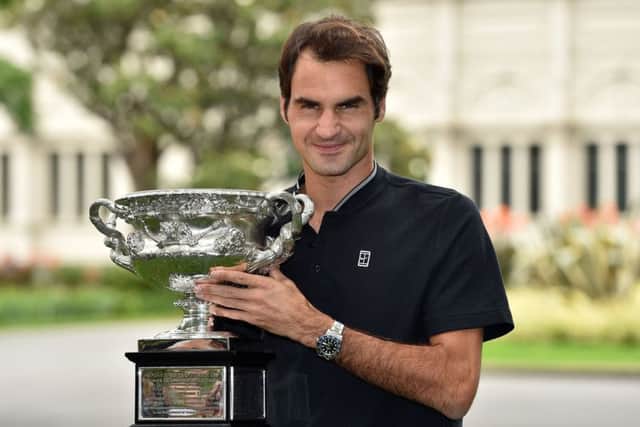 Roger Federer with the championship trophy the day after winning the Australian Open men's singles final for his 18th career grand slam in Melbourne. Picture: Saeed Khan/AFP/Getty Images