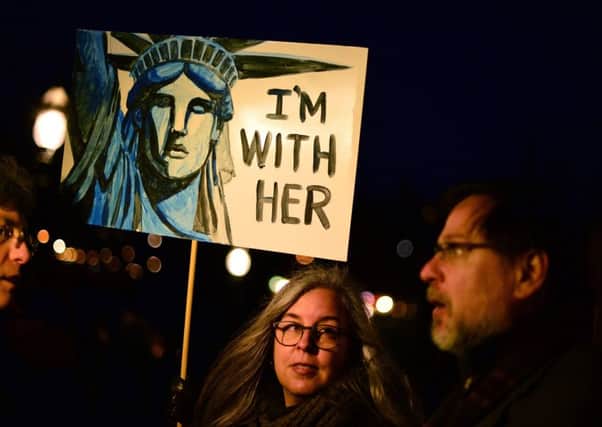 Demonstrators march from the Mound to the Scottish Parliament to protest against President Trump's Muslim travel ban. Picture: Getty Images