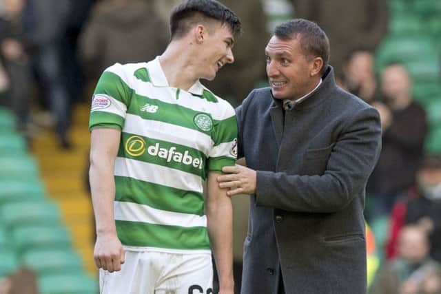 Celtic manager Brendan Rodgers embraces Kieran Tierney after their 4-0 win over Hearts that broke the Lison Lions' unbeaten record.
