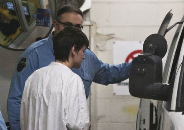 Alexandre Bissonnette is escorted to a van after appearing in court for Sunday's deadly shooting at a mosque in Quebec City. Picture: Jacques Boissinot/The Canadian Press via AP