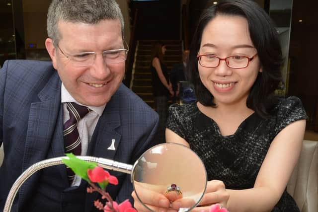 Edinburgh Airport chief Gordon Dewar with Kathy Xin Luo, Laing's Chinese business development manager. Picture: Jon Savage