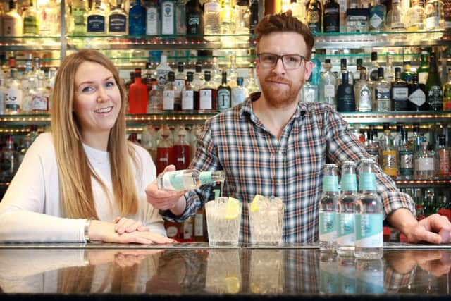 Karen Knowles and Nathan Burrough, founders of relaunched Bon Accord, pour the first batch of their new tonic. Picture: Stewart Attwood