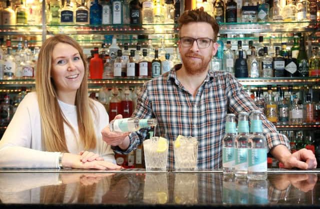 Karen Knowles and Nathan Burrough, founders of relaunched Bon Accord, pour the first batch of their new tonic. Picture: Stewart Attwood