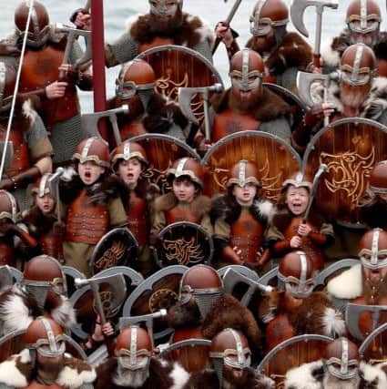 Members of the Jarl Squad, including the junior jarls, on the galley this morning. PIC: Jane Barlow/PA Wire