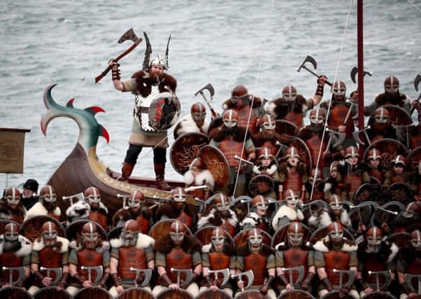 Members of the Jarl Squad dressed in Viking suits on the galley after marching through the street in Lerwick on the Shetland Isles during the Up Helly Aa Viking festival.  Jane Barlow/PA Wire