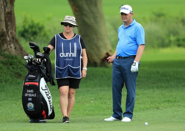 David Drysdale has had his wife Vicky caddying for him.  Picture: Richard Heathcote/Getty Images