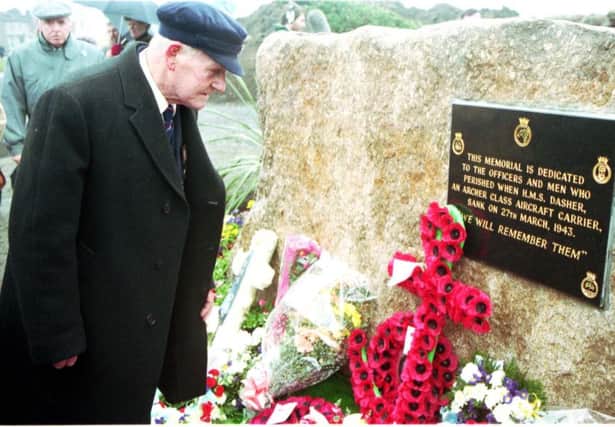 Jeffrey Grey, who was pulled from the water following the sinking of HMS Dasher, helps unveil a memorial to the 379 men who were killed off the coast of Ardrossan in 1943. Picture: Allan Milligan/TSPL