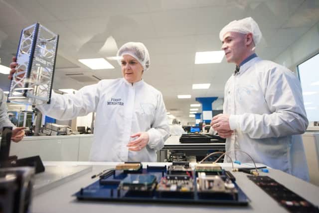 First Minister Nicola Sturgeon visits Clyde Space in 2016 to see first-hand the latest space technology being developed in their 'clean room'. Picture: John Devlin/TSPL