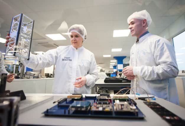 First Minister Nicola Sturgeon visits Clyde Space in 2016 to see first-hand the latest space technology being developed in their 'clean room'. Picture: John Devlin/TSPL
