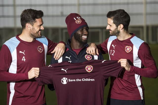 New Hearts signings Esmael Goncalves, centre, Alex Tziolis, left, and Tasos Avlonitis. Picture: SNS Group