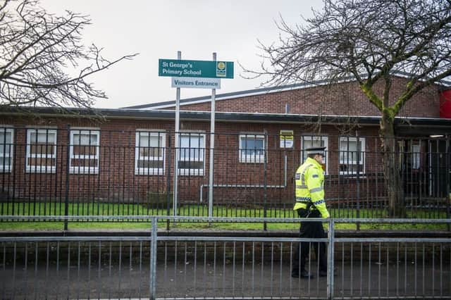 Police forensic team search for evidence the day after the shooting near St George's Primary school. Picture: John Devlin